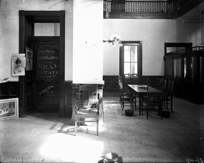 John Rawle Insurance & Real Estate, Natchez Hotel. George François Mugnier or F. E. Derr, c. 1891–1901. Collodion on glass plate, 8 x 10 inches. Louisiana State Museum 09813.0048.