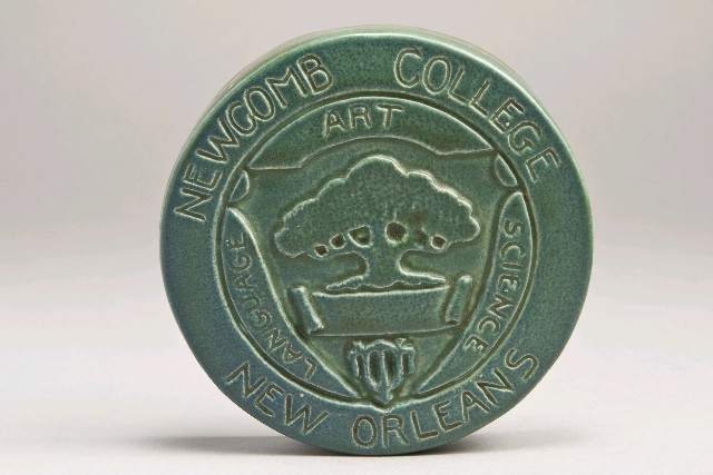Paperweight with Newcomb College seal. Design attributed to William Woodward. Newcomb Pottery, 1914. Earthenware. Gift of Florence R. Kerwin. Louisiana State Museum 1976.058.2.