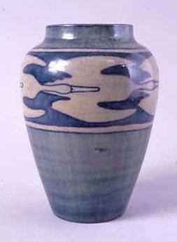 Vase with stylized bird design. Marie de Hoa LeBlanc, decorator. Joseph Meyer, potter. Newcomb Pottery , ca 1901. Earthenware. Louisiana State Museum 1980.194.