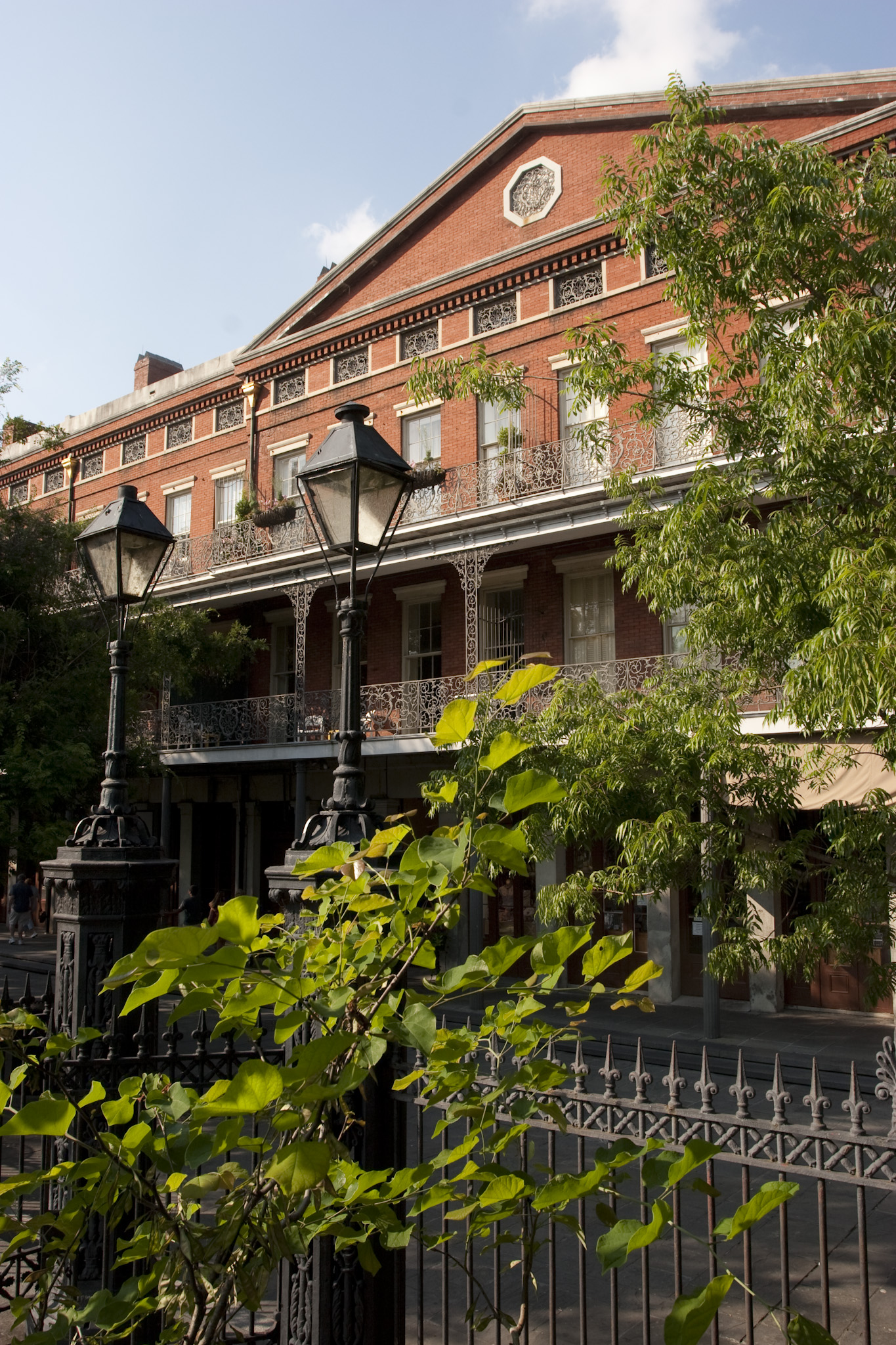 Lower Pontalba with commercial spaces on the first floor and residential apartments on the second and third floors