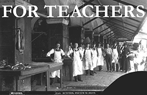 For Teachers: Button graphic reading “For Teachers” above a historic black-and-white photograph of a group of men in white aprons standing outside a market building.