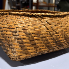 Choctaw Rite of Passage Basket: A Choctaw rite of passage basket from the Cane River Creole National Historical Park collection. This intricately woven basket, used in traditional ceremonial practices, reflects the cultural heritage and craftsmanship of the Choctaw people, who played a vital role in the history of the Cane River region.