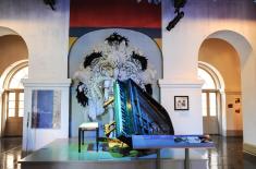 Piano and costume display in Presbytere