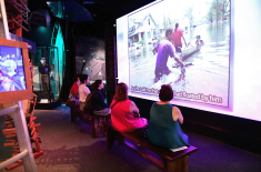 Families explore the Living with Hurricanes: Katrina and Beyond exhibition at the Presbytere in Jackson Square