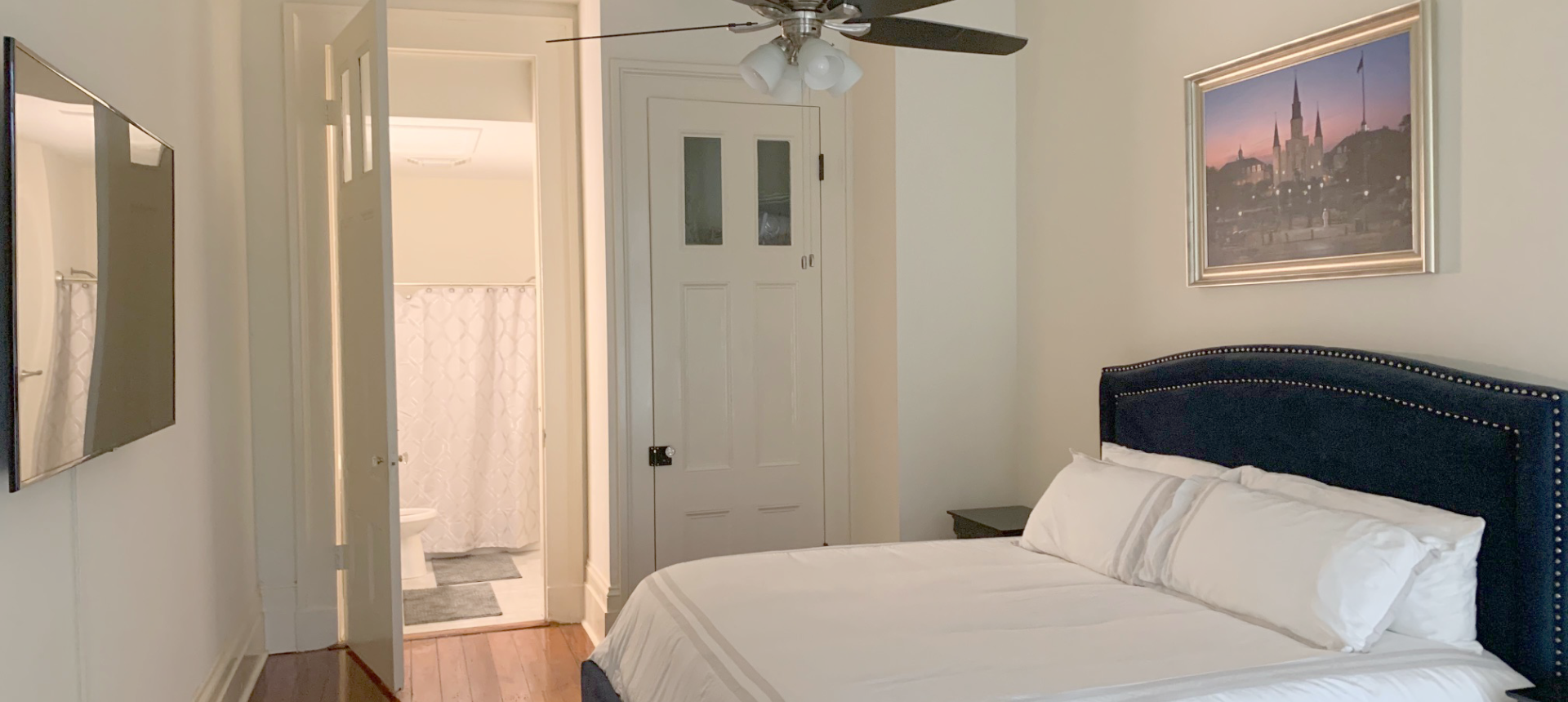 Bedroom located in one of the historic apartments at the Lower Pontalba Building