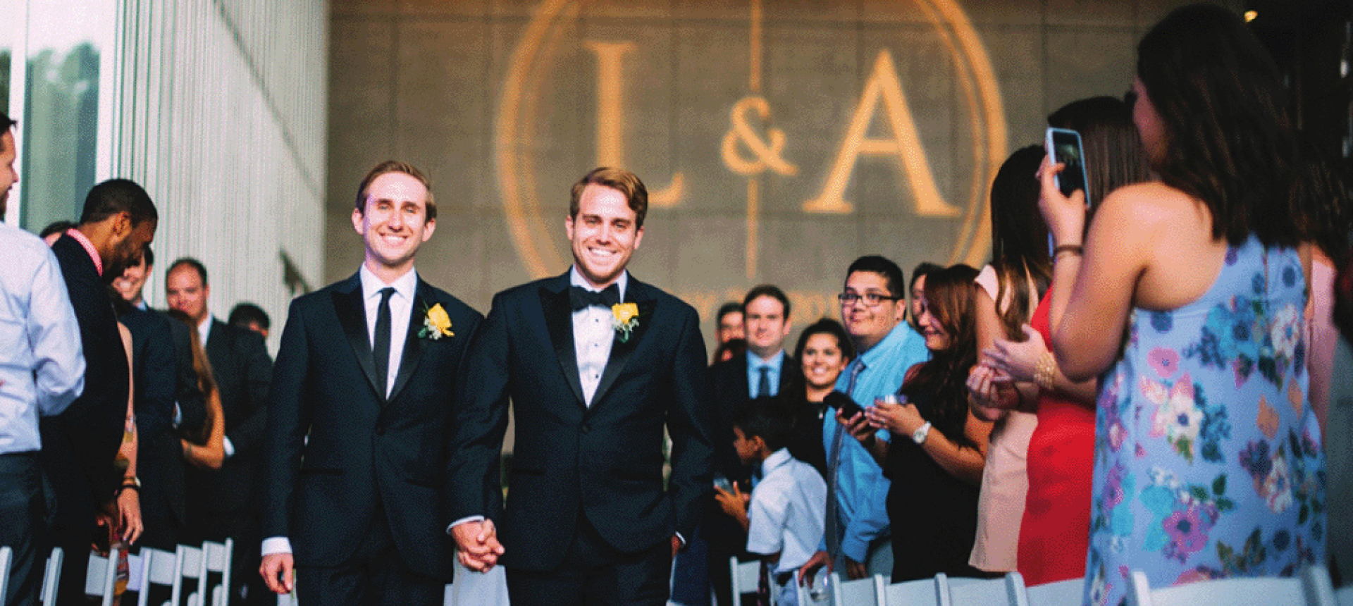 Happy couple walks down the aisle during their wedding at Capitol Park Museum
