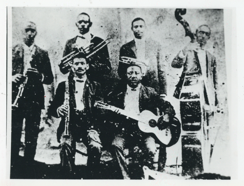 Buddy Bolden's Band; left to right, William Warner, William Cornish, Charlie "Buddy" Bolden, James Johnson, Frank Lewis (seated), Jeff "Brock" Mumford (seated). Courtesy of the New Orleans Jazz Club Collection.