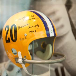Heisman trophy winners helmet behind glass