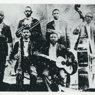 Buddy Bolden's Band; left to right, William Warner, William Cornish, Charlie "Buddy" Bolden, James Johnson, Frank Lewis (seated), Jeff "Brock" Mumford (seated). Courtesy of the New Orleans Jazz Club Collection.